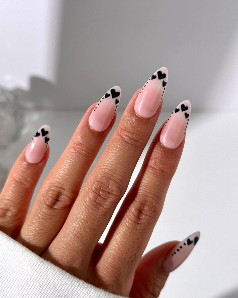 Valentine's Day Nail Ideas that inspire you nude base with stunning black hearts 