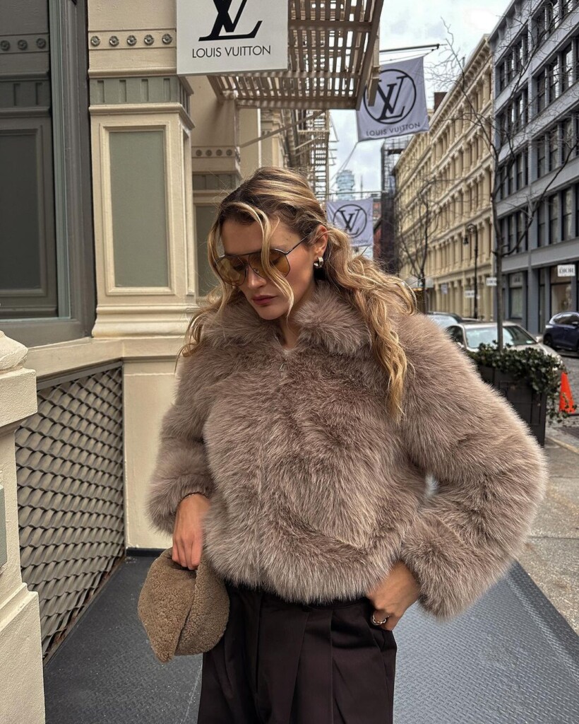 BEST INFLUENCER OUTFITS ROUND UP - WINTER LOOKS Influencer and model Chloe Lecareux wearing cute faux fur coat with brown tones outfit