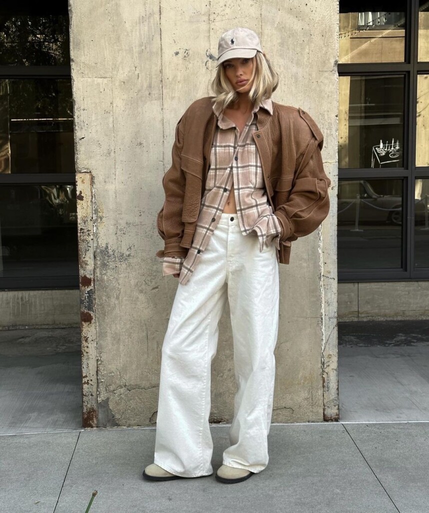 Steal Elsa Hosk style - Elsa in a cool off duty look - white jeans, oversized bomber jacket and cap