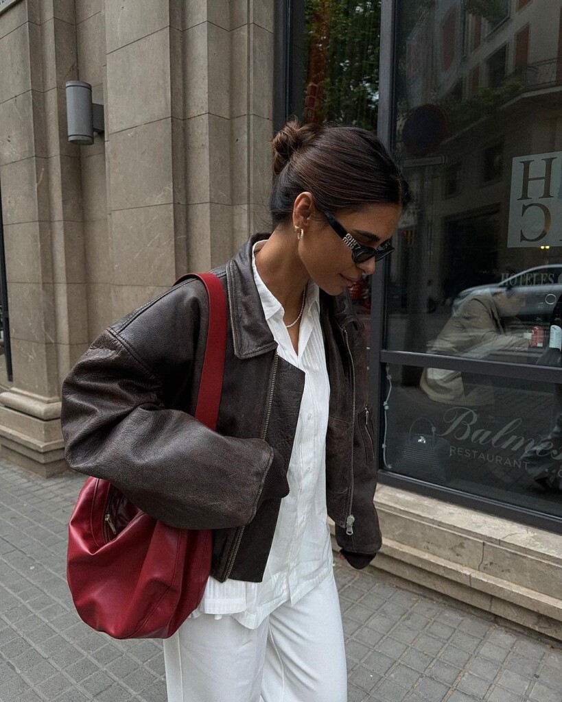 7 Casual Outfits to wear this week emitaz wearing miu miu glasses, leather jacket, red bag and light shirt and trousers 